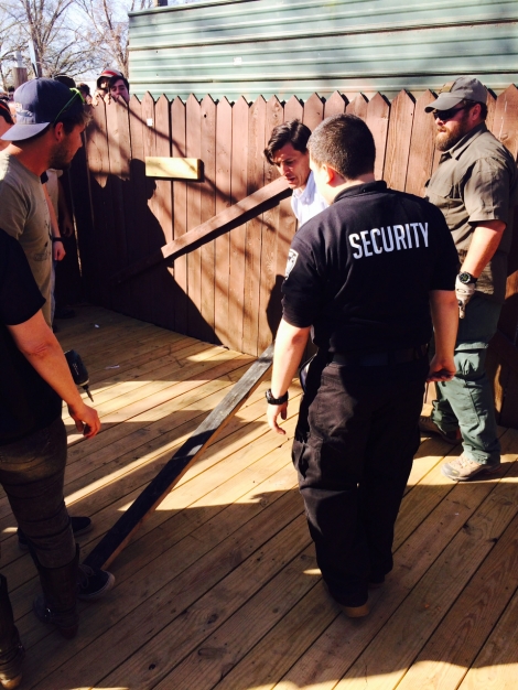 Security attempting to reinforce the gate at Tyler, the Creator's SXSW show at Scoot Inn