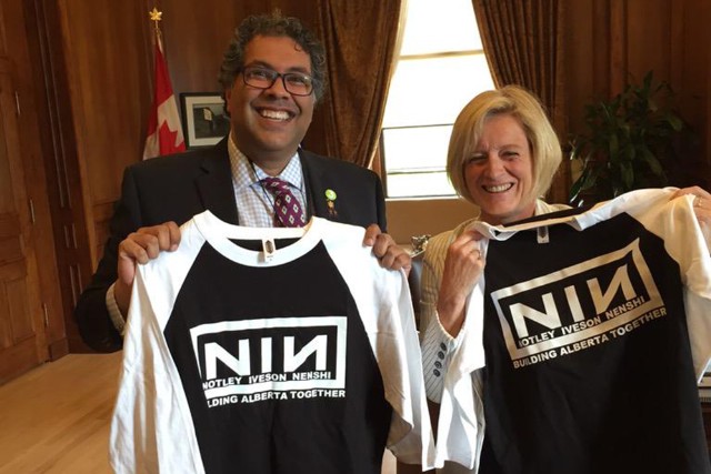 Canadian politicians holding T-shirts with NIN logo