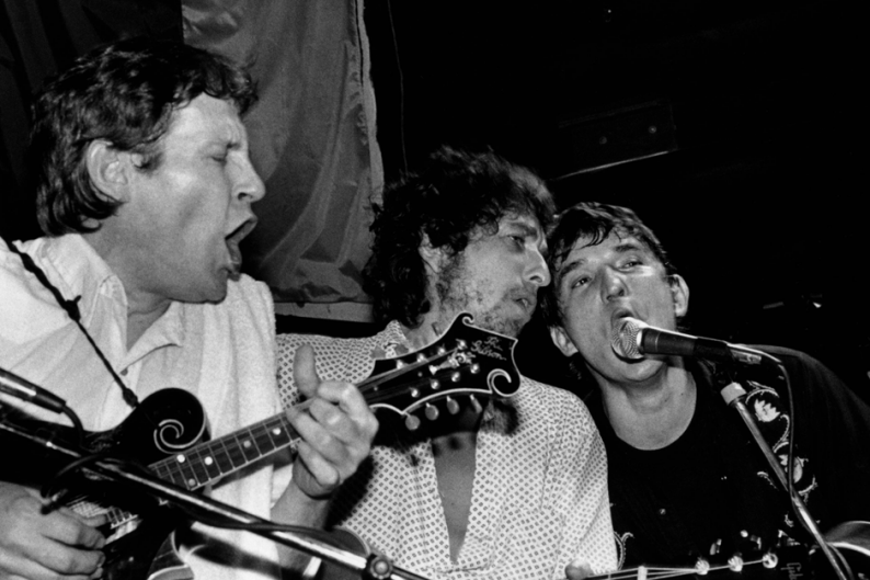 Levon Helm, Bob Dylan, Rick Danko performing live onstage at Lone Star Cafe / Photo by Elliott Landy/Redferns