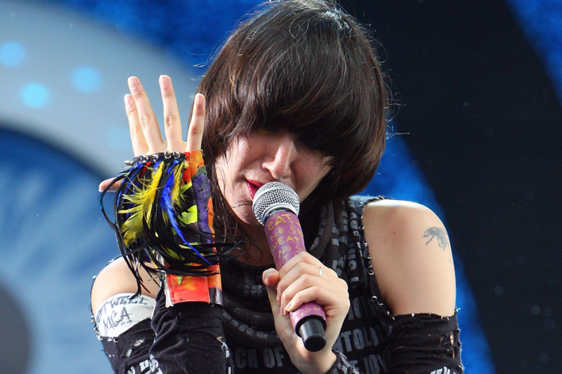 Karen O, sporting a 'Get Well, MCA' armband at All Points West 2009 / Photo by Theo Wargo/WireImage