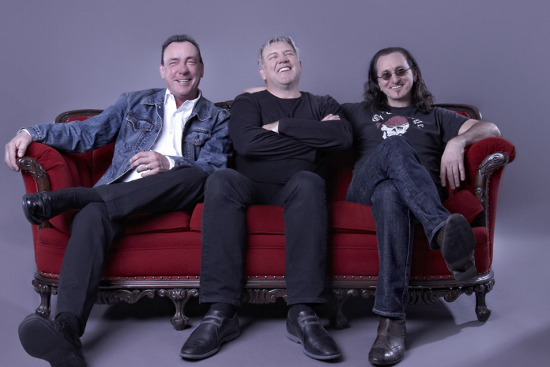 From left to right: Rush's Neil Peart, Alex Lifeson, and Geddy Lee / Photo by Andrew MacNaughtan
