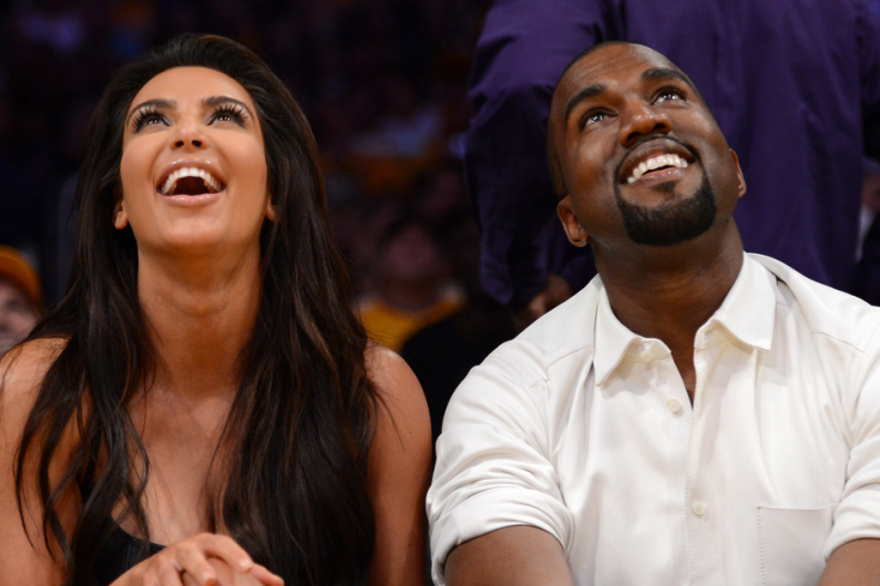 This is literally the only photo of Kanye West smiling on Getty Images / Photo by Harry How/Getty
