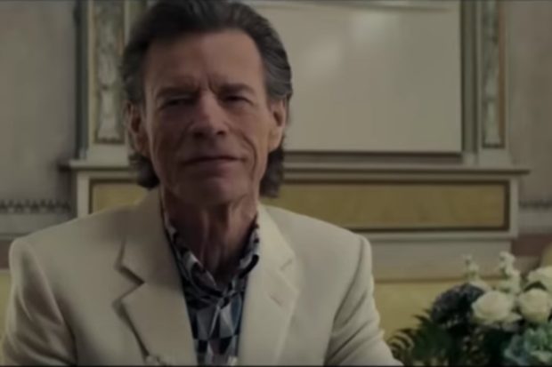 Mick Jagger Plays a Sinister Art Dealer in The Burnt Orange Heresy Trailer: Watch