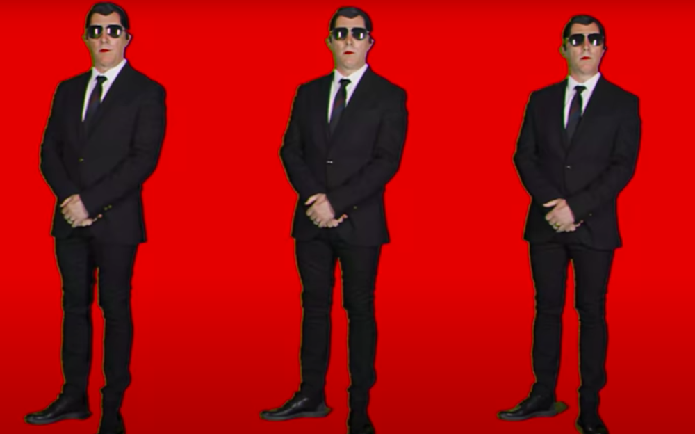 Puscifer Are Suited Up in 'Fake Affront' Video