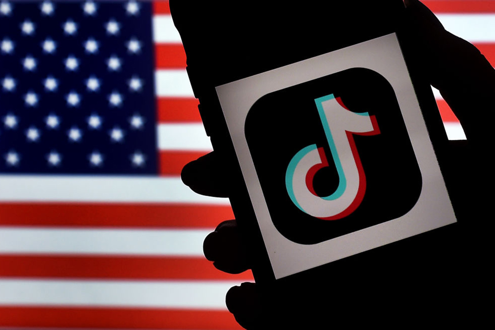 Tik Tok app in front of the U.S. Flag
