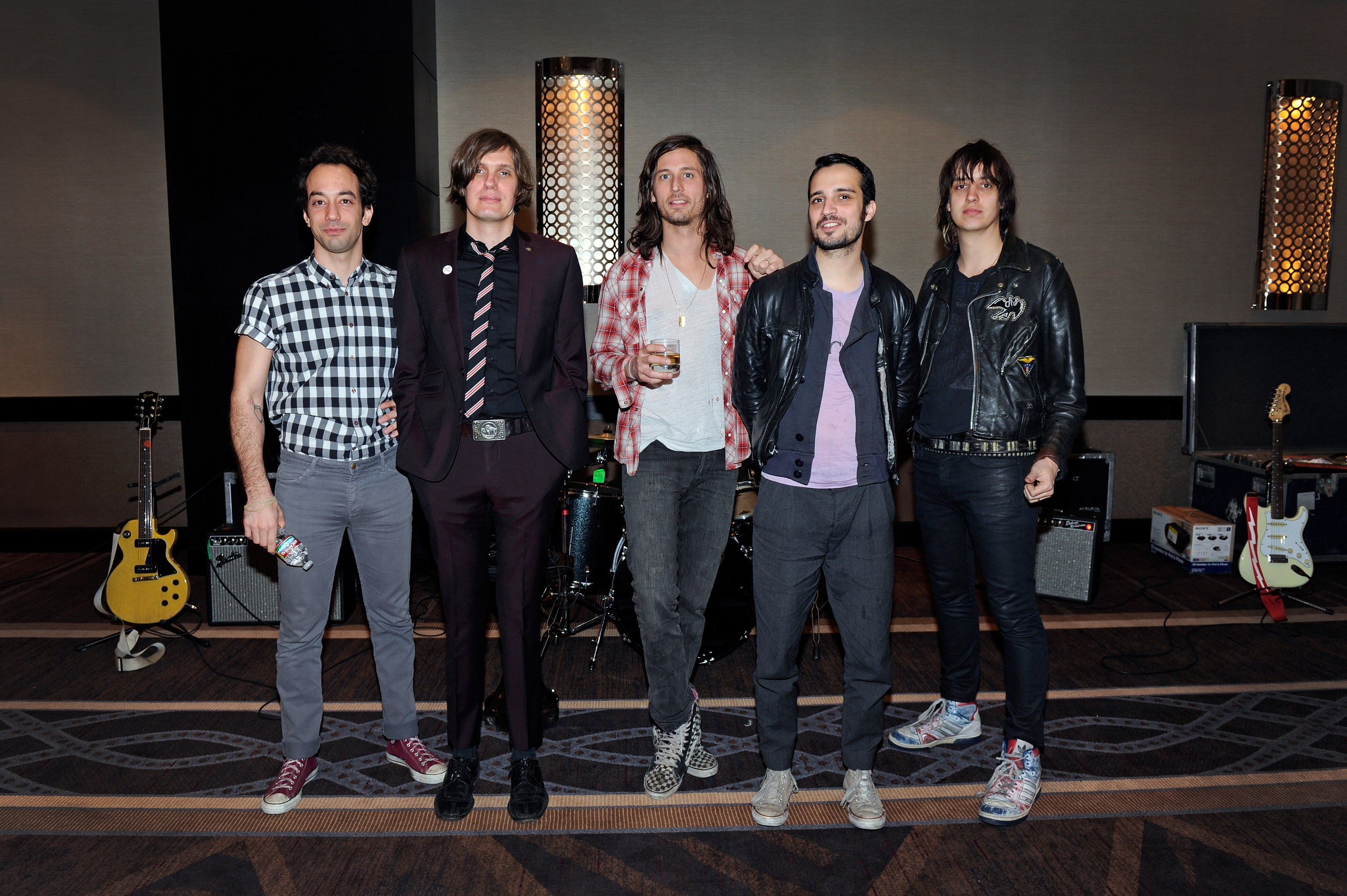 LAS VEGAS, NV - MARCH 12:  (L-R) Albert Hammond Jr, Nikolai Fraiture, Nick Valensi, Fabrizio Moretti and Julian Casablancas of The Strokes attend a meet and greet prior to their concert at The Cosmopolitan of Las Vegas on March 12, 2011 in Las Vegas, Nevada.  (Photo by David Becker/WireImage)