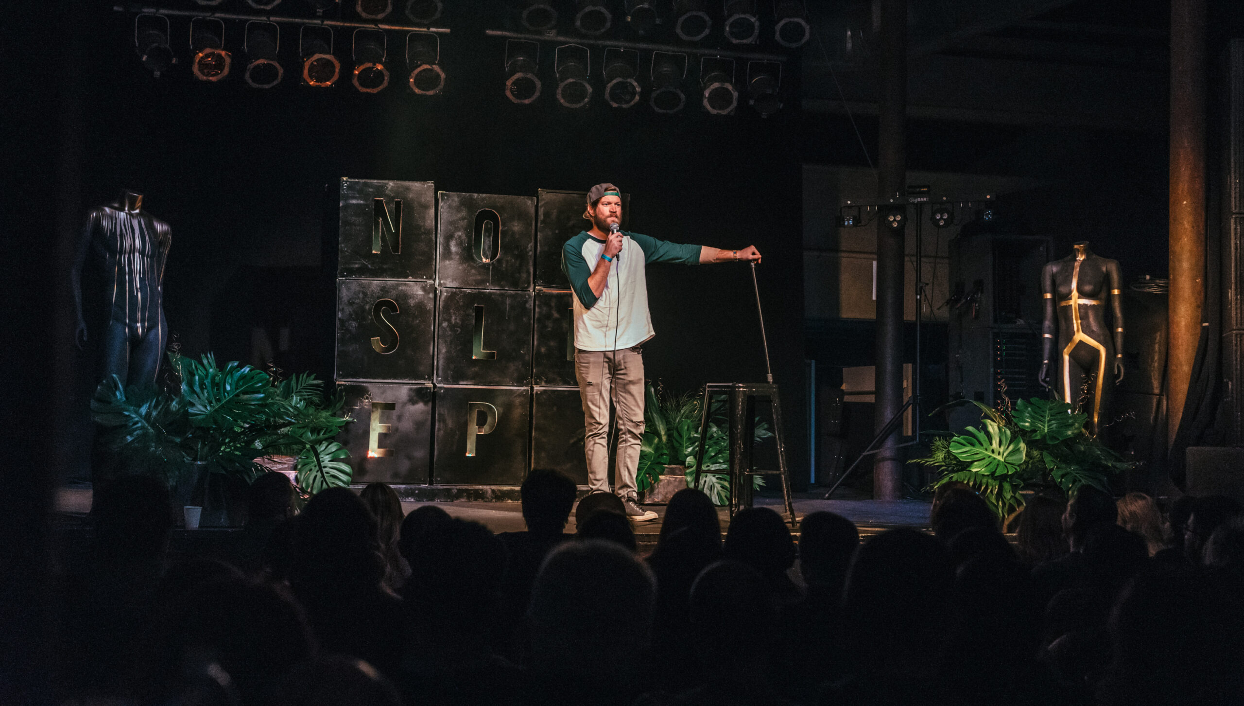 This is an image of Sam Hirchak performing at a comedy club in Des Moines.