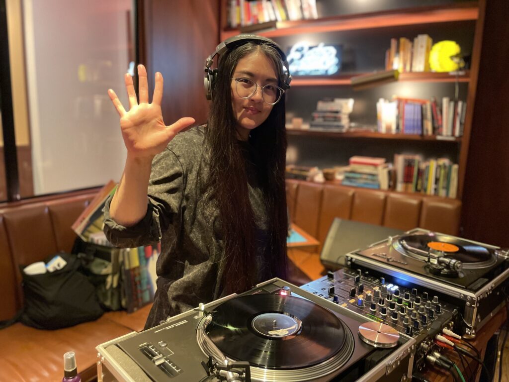 This is an image of Les Talusan spinning vinyl at Eaton DC hotel