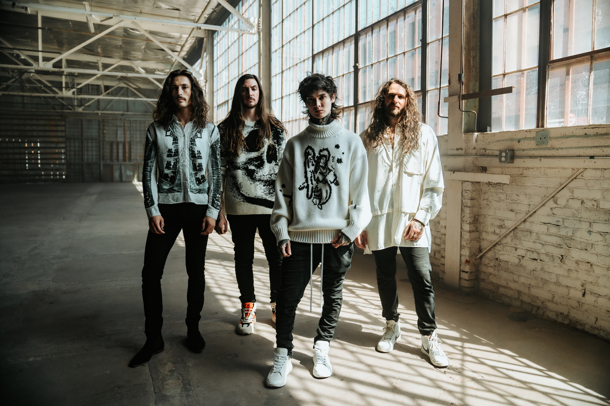 Polyphia's sweater game is as strong as their musicianship. (Photo by Alana Ann Lopez)
