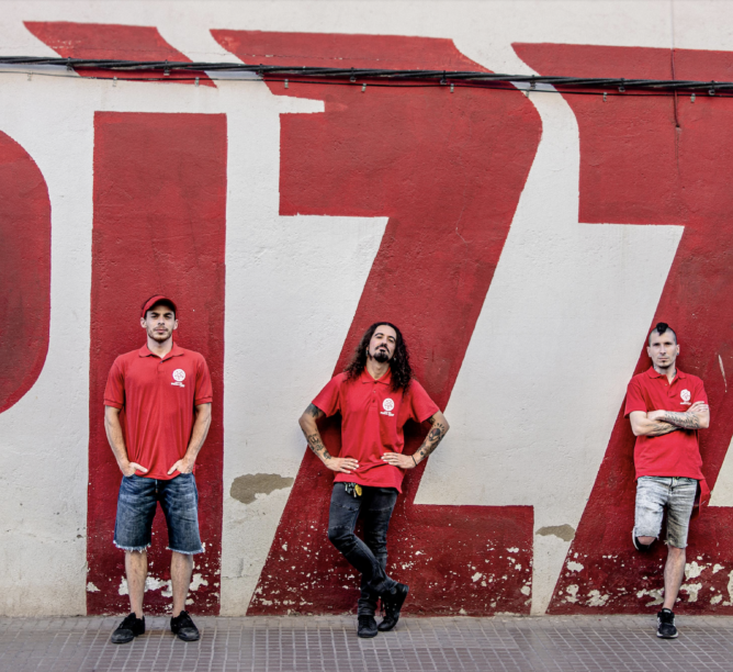 Crisix, who say pizza is in their DNA, pose as pizza guys for 'The Pizza EP.' (Credit: Victor Gómez)
