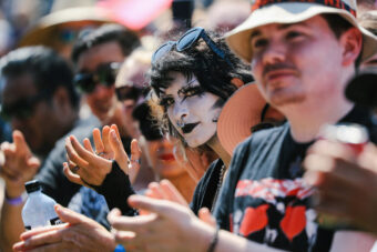 A fan watches The Vapors perform on the Sad Girls stage at Cruel World Festival at Pasadena's Rose Bowl, Saturday, May 20, 2023. (Credit: Allen J. Schaben / Los Angeles Times)