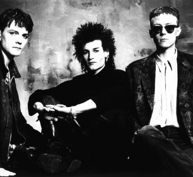 Love and Rockets in 1987. (Credit: Fin Costello/Redferns)