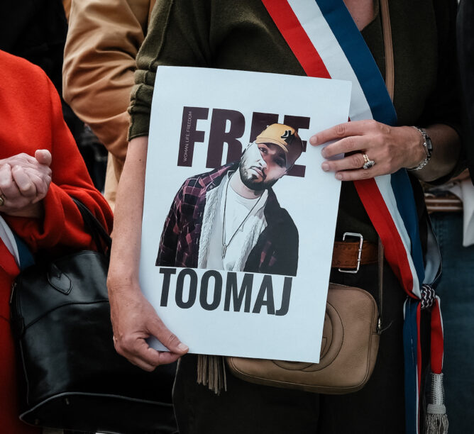 A protester holds a poster reading 'Free Toomaj' during the rally organized by the Souliranation association against the death sentence of Iranian rapper Toomaj Salehi in Toulouse, southwest of France, on May 5, 2024. (Credit: Pat Batard / Hans Lucas / Hans Lucas via AFP)