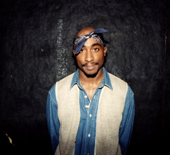 Tupac Shakur poses for photos backstage after his performance at the Regal Theater in Chicago, March 1994. (Credit: Raymond Boyd/Getty Images)