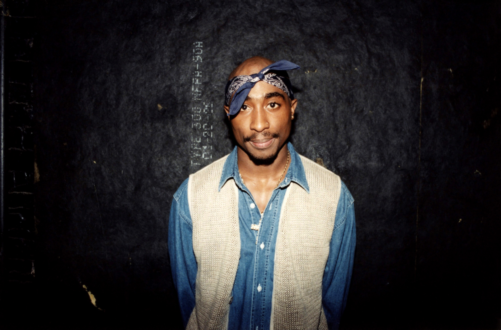 Tupac Shakur poses for photos backstage after his performance at the Regal Theater in Chicago, March 1994. (Credit: Raymond Boyd/Getty Images)