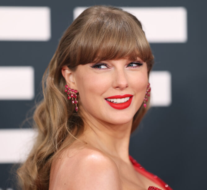 Taylor Swift smiles at the 2025 Grammy Awards.