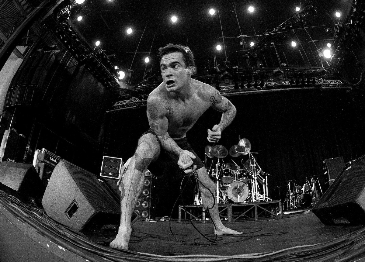 Singer/Songwriter Henry Rollins performs during Lollapalooza at Lakewood Amphitheater in Atlanta Georgia, 1991 (Credit: Rick Diamond/Getty Images)