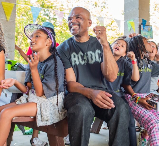 Darryl “DMC” McDaniels sits with campers at Camp Felix. (Credit: Lisa Nalven)
