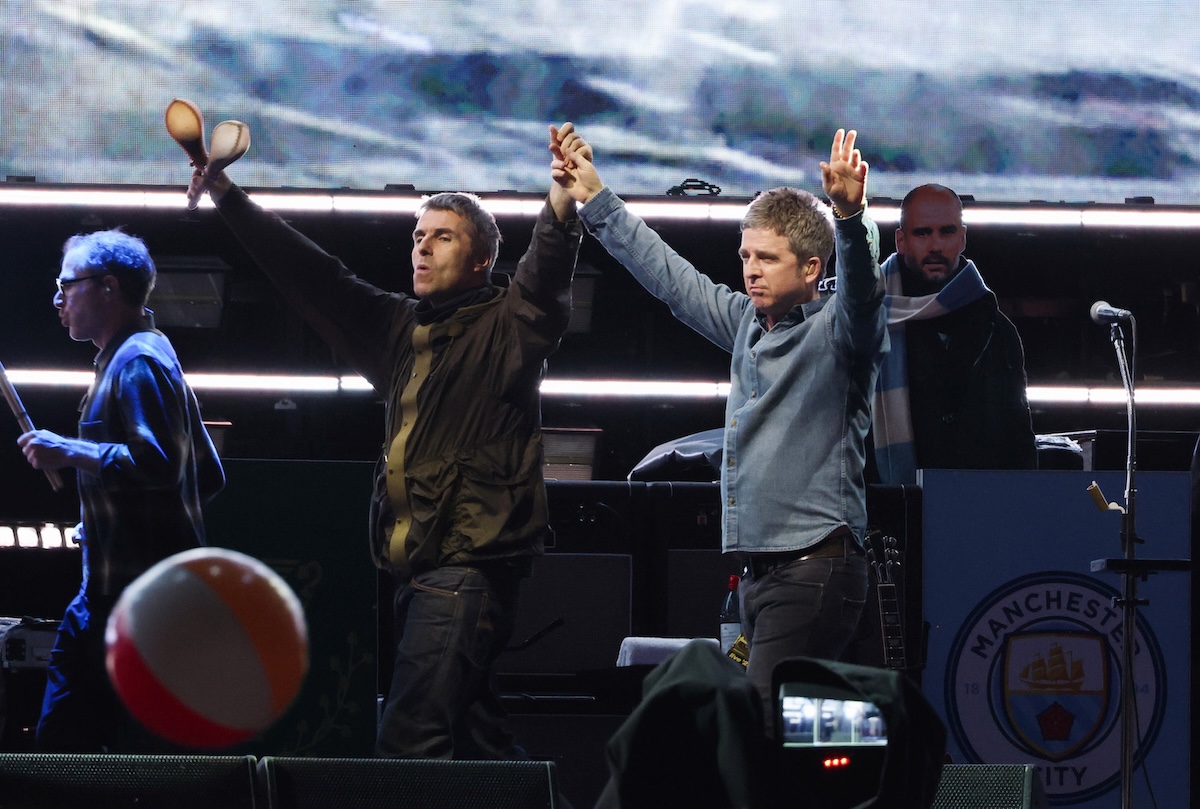 Liam and Noel Gallagher perform onstage at Rogers Stadium on August 24, 2025 in Toronto, Ontario. (Credit: Kevin Mazur/Getty Images)