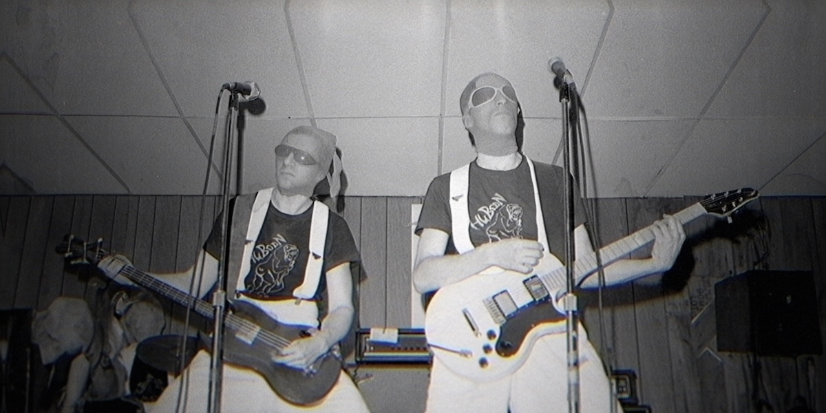  Jerry Casale and Bob Mothersbaugh performing with stocking on their heads. (Courtesy of Netflix)