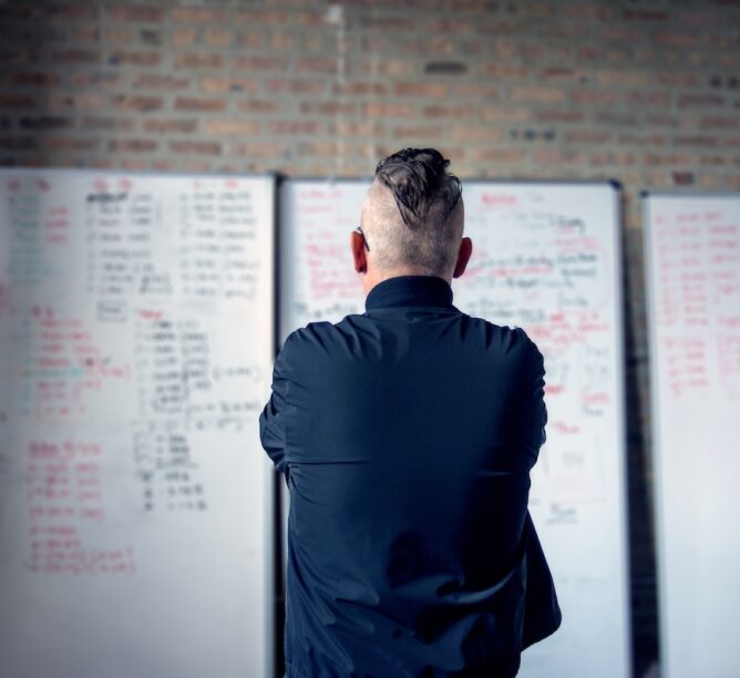 Riot Mike hard at work with his many whiteboards. (Photo courtesy of Riot Fest.)