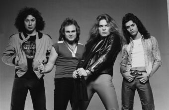 Van Halen in 1978. Left to Right: Alex Van Halen, Michael Anthony, David Lee Roth, and Eddie Van Halen. (Credit: Fin Costello/Redferns)