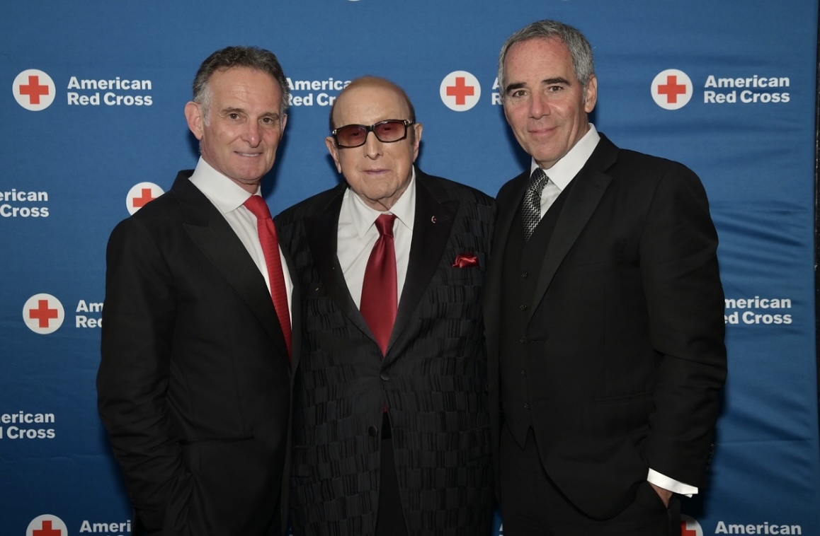 Charles Goldstuck being honored by the American Red Cross (left), pictured with Clive Davis (center), CCO Sony Music, and Monte Lipman (right), chairman and CEO of Republic Records. (Credit: Bob Capazzo, Cara Gilbride)