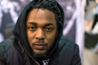 Kendrick Lamar signs copies of his new album 'To Pimp A Butterfly' at Rough Trade NYC record store on March 20, 2015, in New York City. (Credit: Mike Pont/Getty Images)