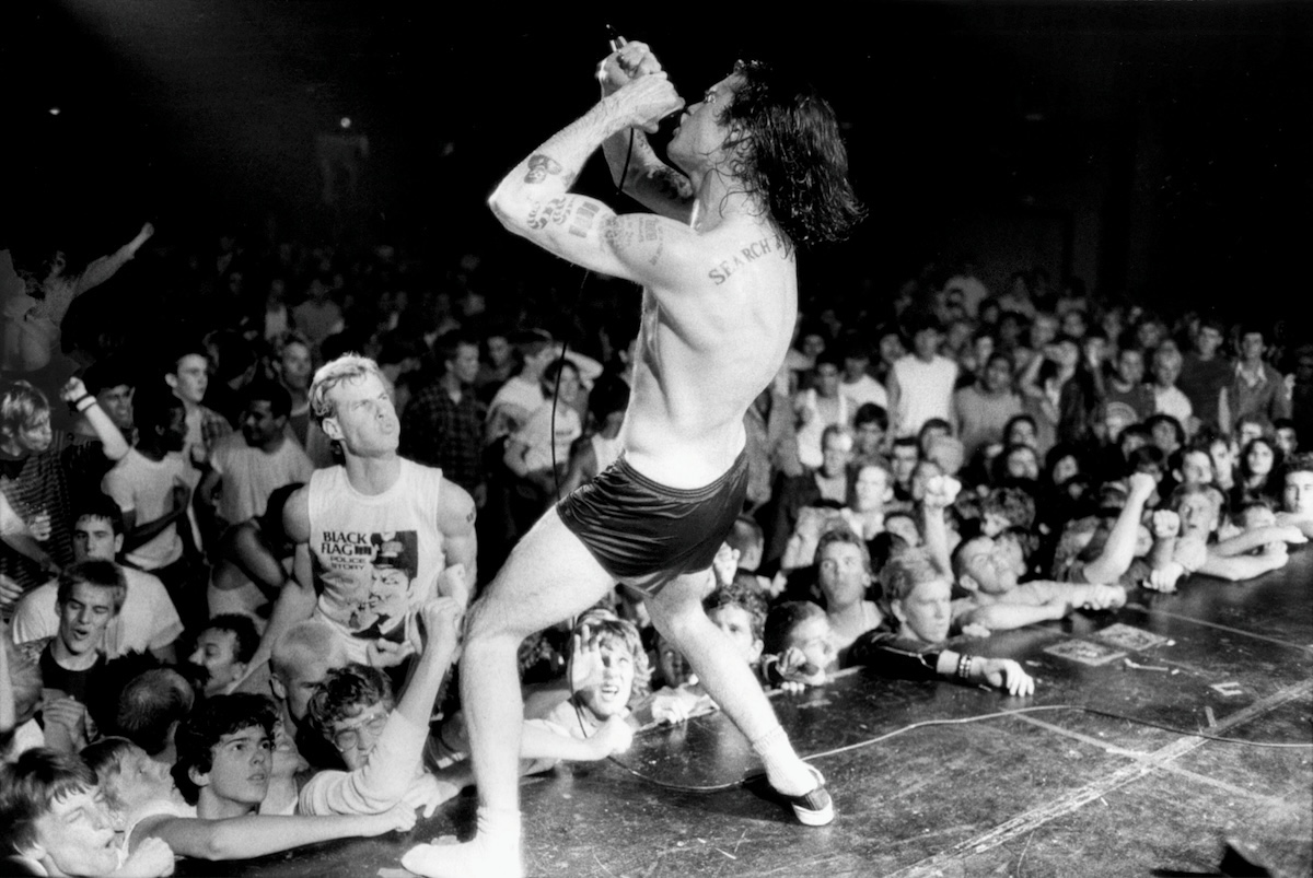 Henry Rollins during a Black Flag concert at Perkins Park on May 5, 1984. (Credit: Iris Schneider / Los Angeles Times)