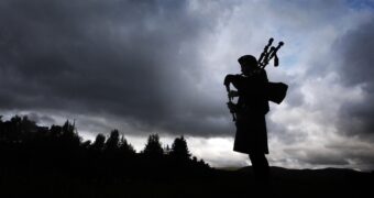 Calum Winter, 14, plays the bagpipes at the annual Braemar Gathering, at the Princess Royal and Duke of Fife Memorial Park in Scotland. (Credit: Danny Lawson - PA Images/PA Images via Getty Images)