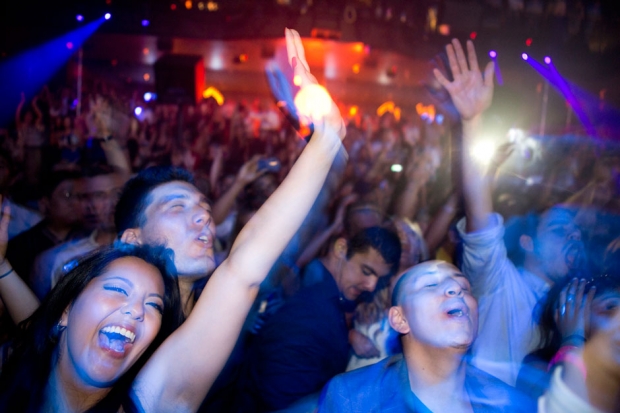 Club goers dance as DJ Sebastian Ingrosso spins at Light Nightclub in Las Vegas on July 5, 2013 / Photo by Leila Navidi