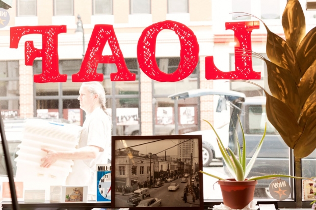 A photograph of the historic Parrish Street corridor sits in the window of Loaf bakery. / Photo by Jeremy M. Lange