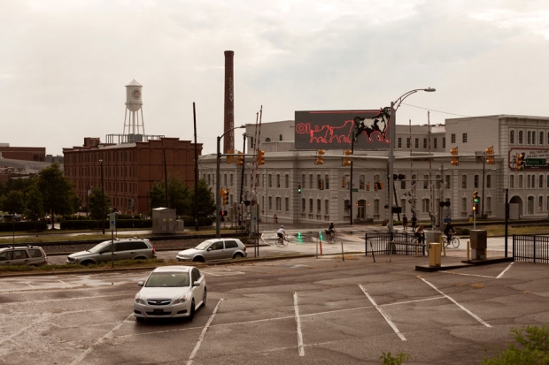 The Lucky Strike water tower and smokestack and Bull Durham Tobacco neon sign / Photo by Jeremy M. Lange