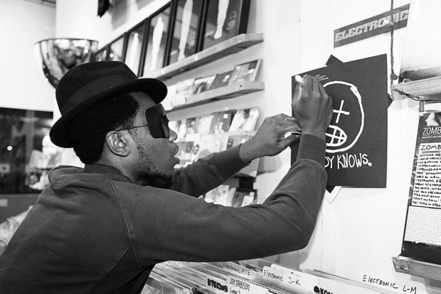 Willis Earl Beal signs a copy of Nobody Knows / Photo by Jordan Jablon for SPIN