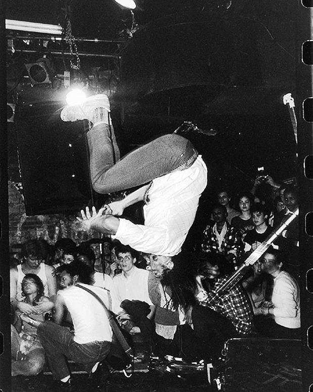 Bad Brains' H.R. does a backflip at CBGB's, c. 1982 / Photo by Glen E. Friedman